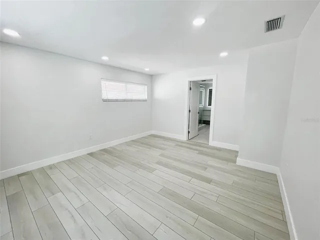 a bathroom with a shower and toilet