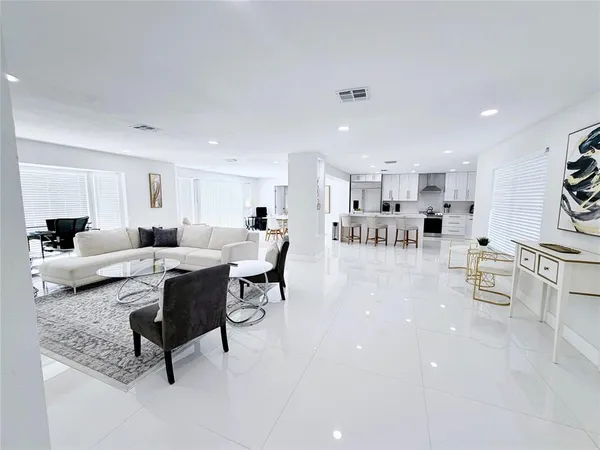 a bathroom with a tub mirror and window