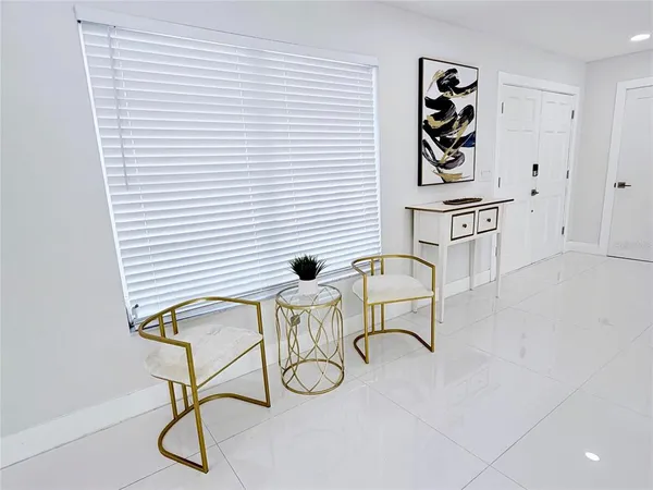 a living room with furniture and a table