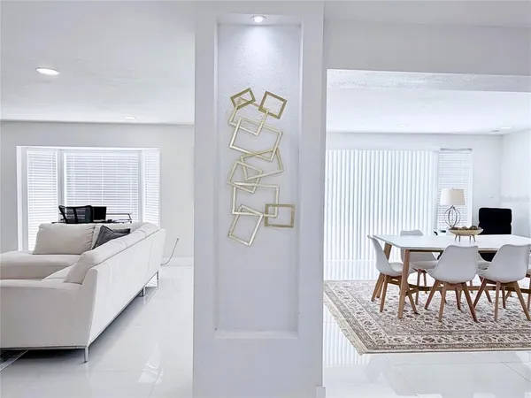 a bathroom with a double vanity sink a toilet and a shower