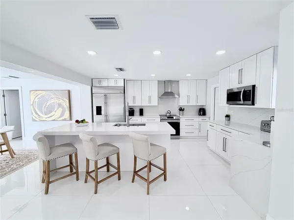 a bathroom with a shower and a sink
