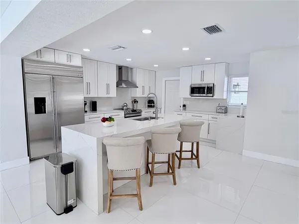 a bathroom with a walk in closet and mirror