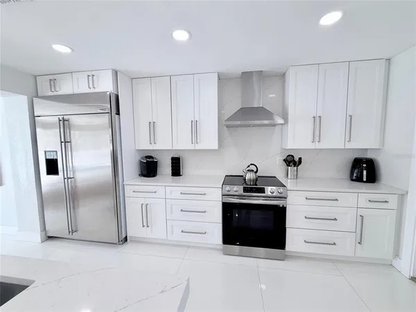 a bedroom with two beds and a dresser