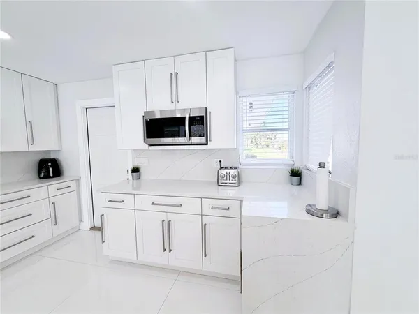 a bedroom with two beds and a tv