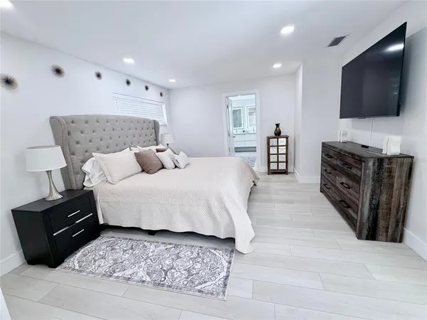 a view of a chair and table in wooden floor