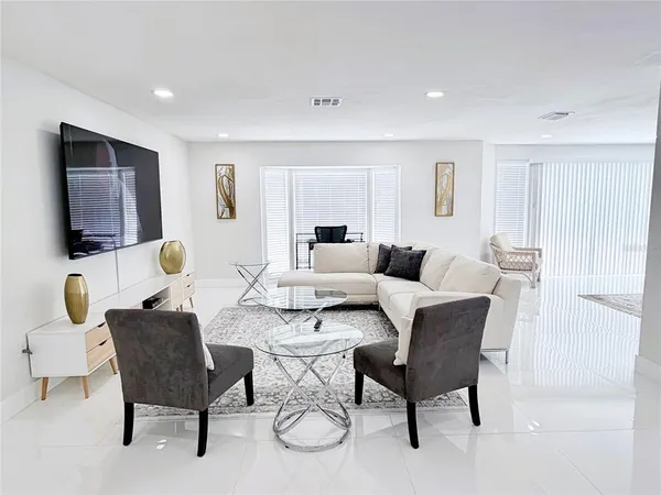 a living room with furniture and a rug
