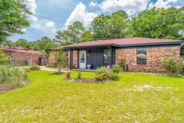 a view of house with a swimming pool