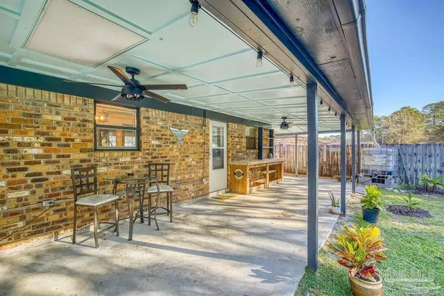 a view of a porch with chairs and table