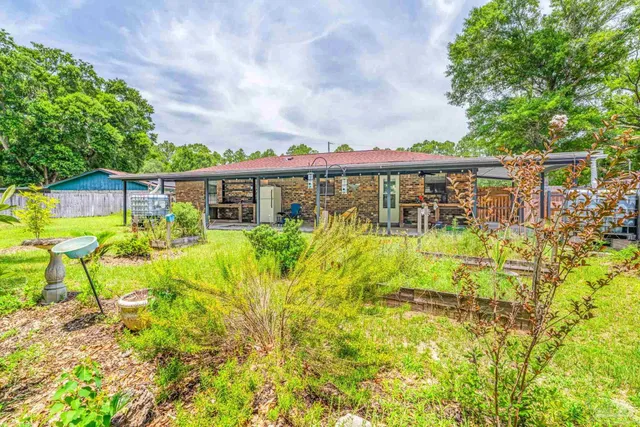 a view of a backyard of the house