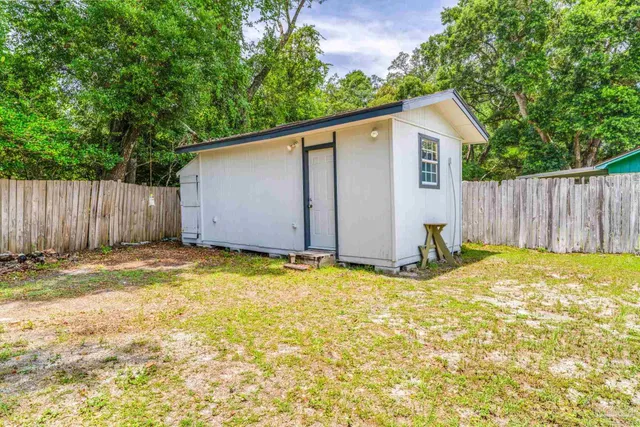 a house with swimming pool in front of it