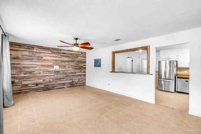 a view of an empty room with a fireplace