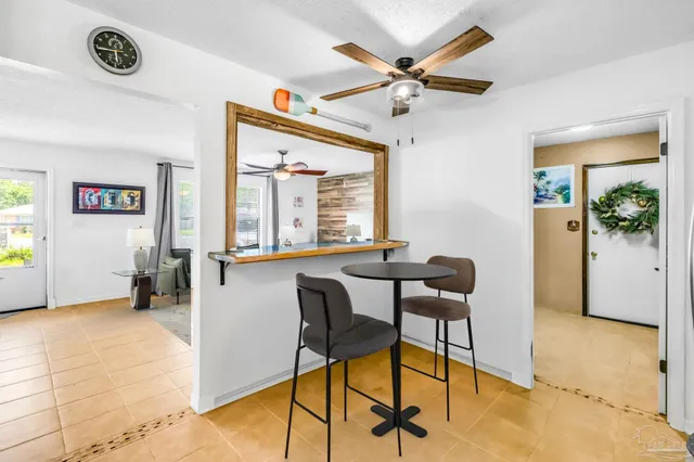 a view of a livingroom with furniture and a window