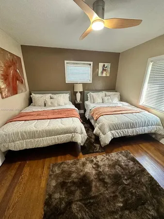 a bedroom with bed and window
