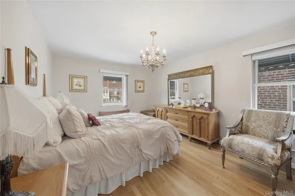 a spacious bedroom with a bed and a couch