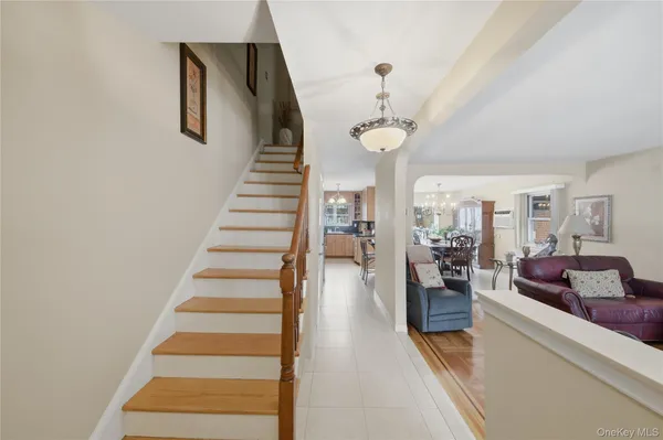 a view of a living room and entryway