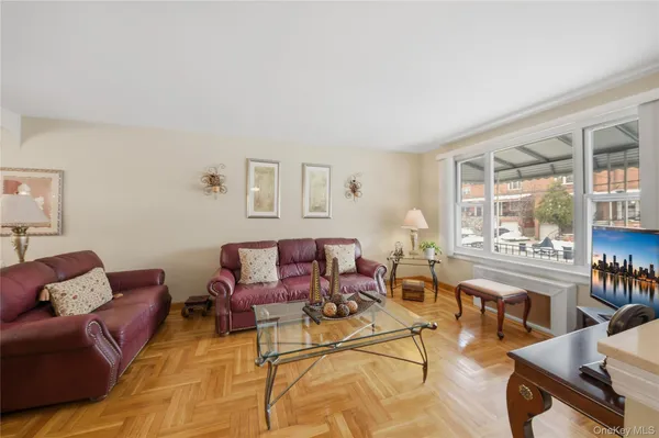 a living room with furniture and a lamp