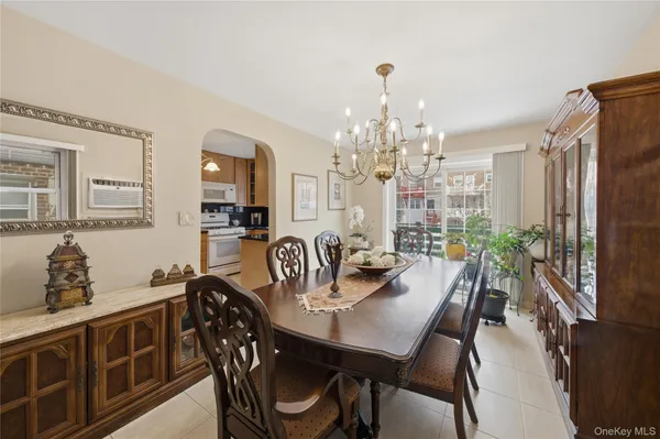 a view of a a dining room with furniture window and wooden floor
