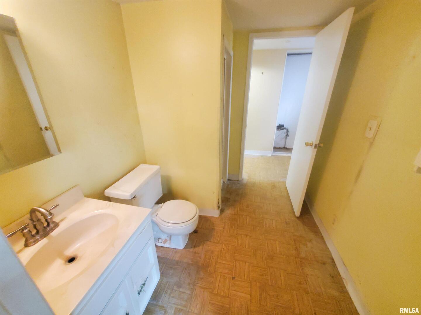 1182 25th Street Moline, IL 61265 - Photo 12 of 17 a bathroom with a sink and a toilet