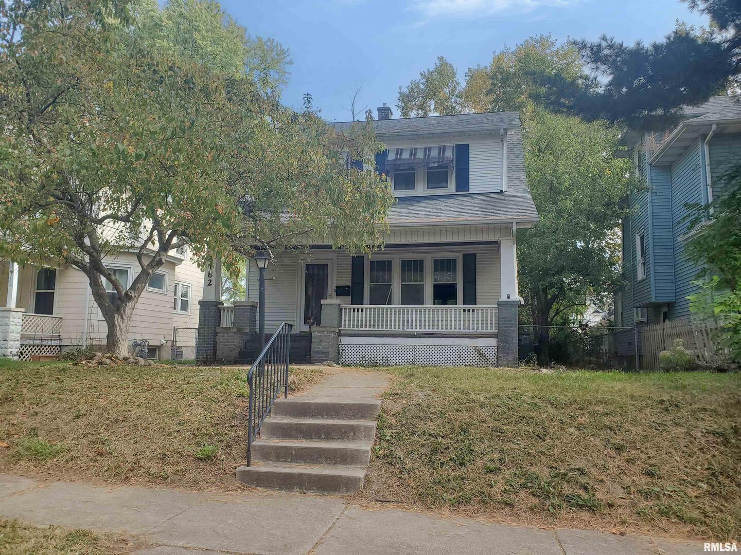 1182 25th Street Moline, IL 61265 - Photo 2 of 17 front view of a house with a yard
