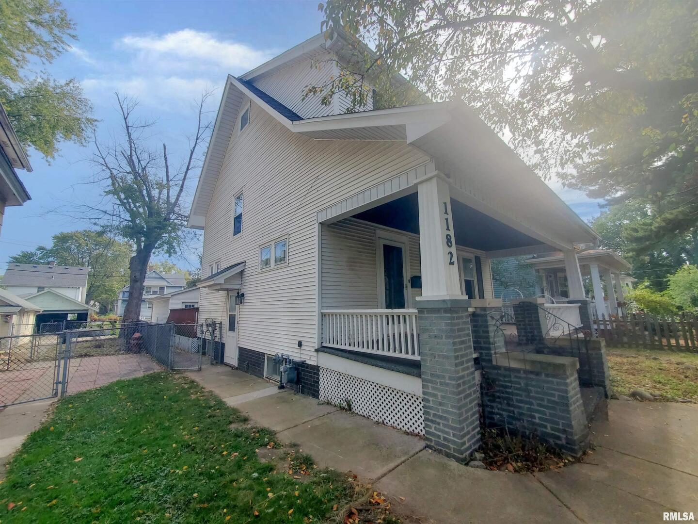 1182 25th Street Moline, IL 61265 - Photo 4 of 17 a view of a house with a yard