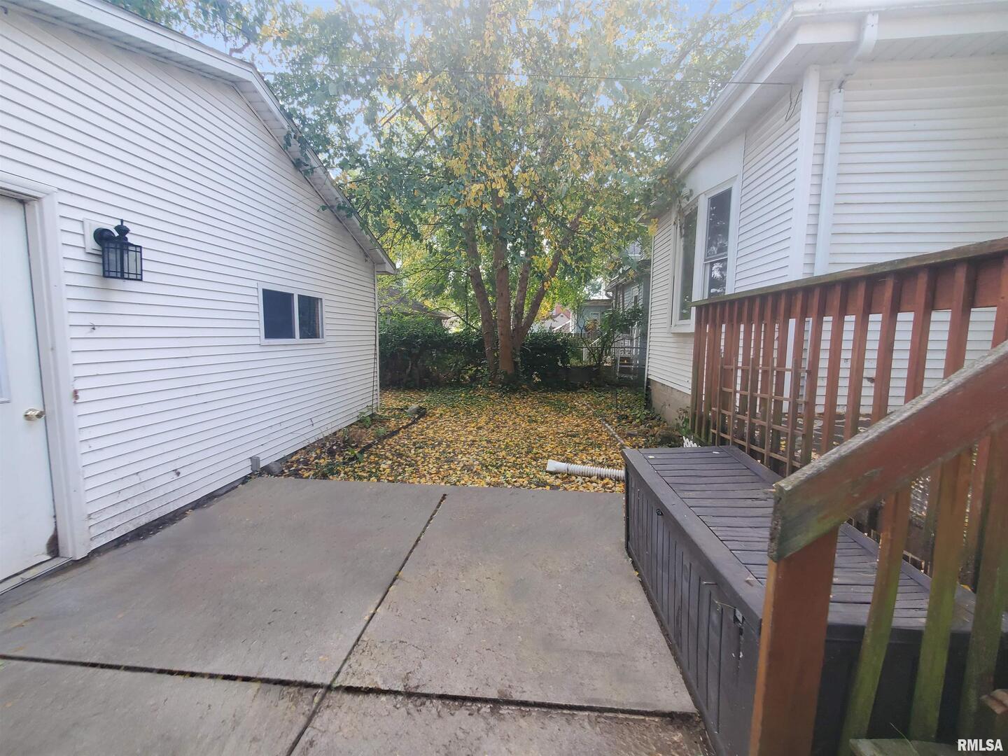 1182 25th Street Moline, IL 61265 - Photo 5 of 17 a view of a house with a yard