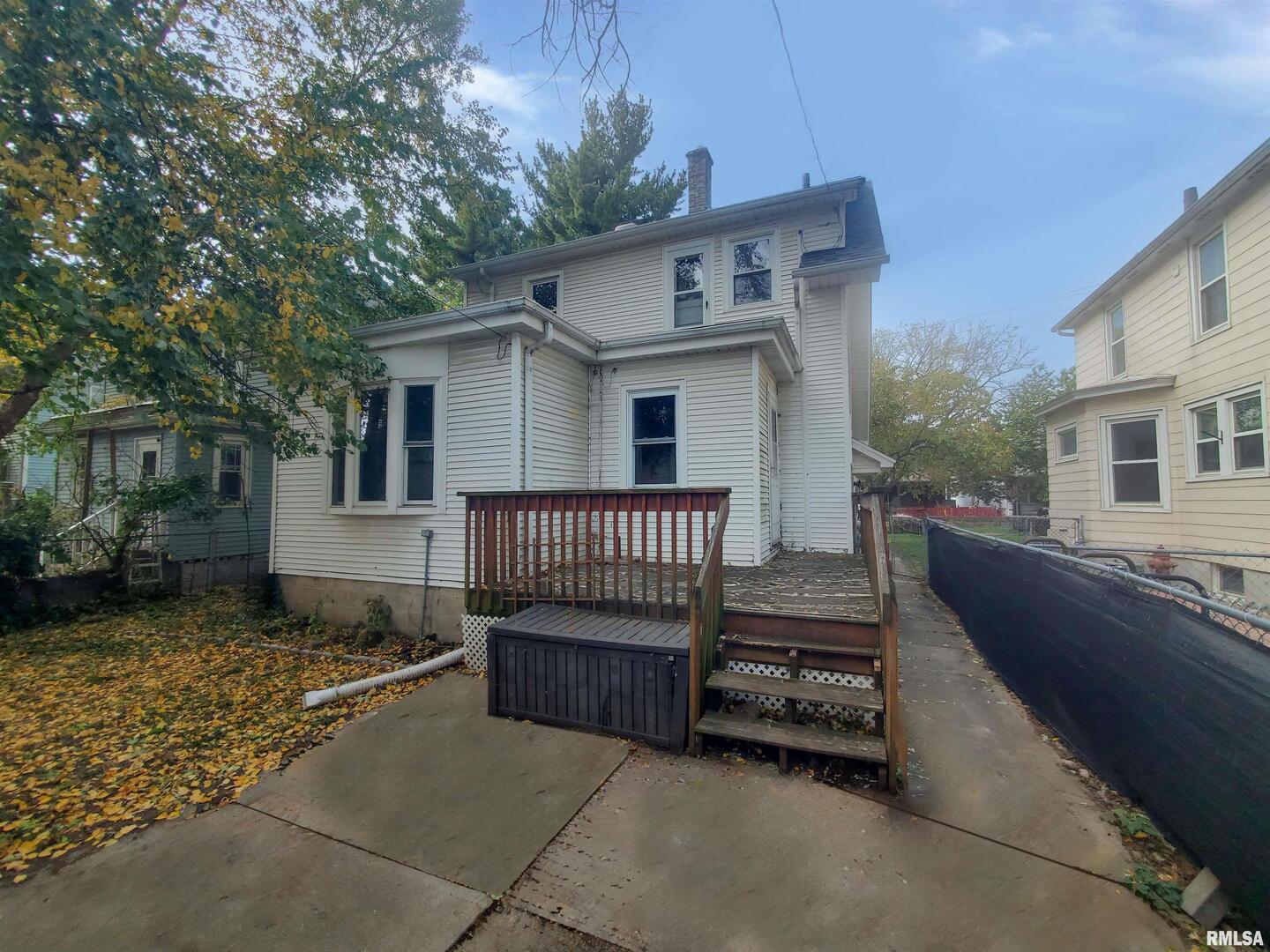 1182 25th Street Moline, IL 61265 - Photo 6 of 17 a view of a house with a yard