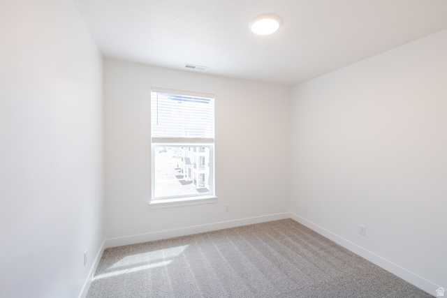 693 West 4500th South, Unit O303 Mapleton, UT 84664 - Photo 5 of 15 Spare room featuring light colored carpet and baseboards