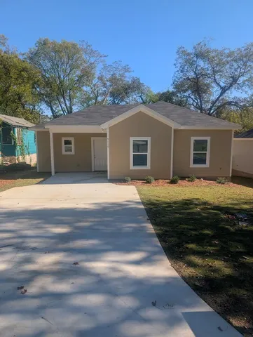 a front view of a house with yard