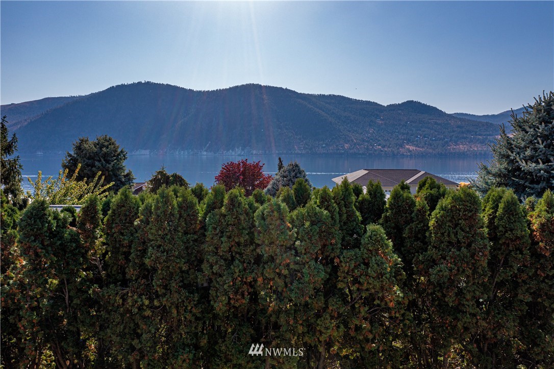 755 Wapato Way Manson, WA 98831 - Photo 2 of 40 a view of a house with a garden