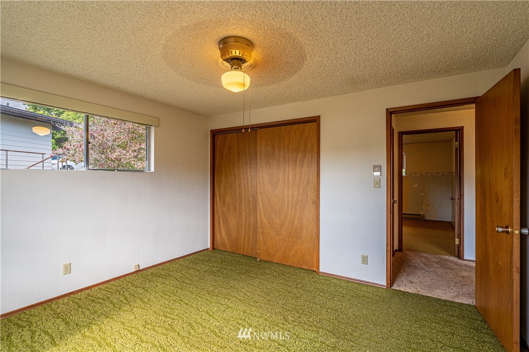 755 Wapato Way Manson, WA 98831 - Photo 17 of 40 an empty room with windows