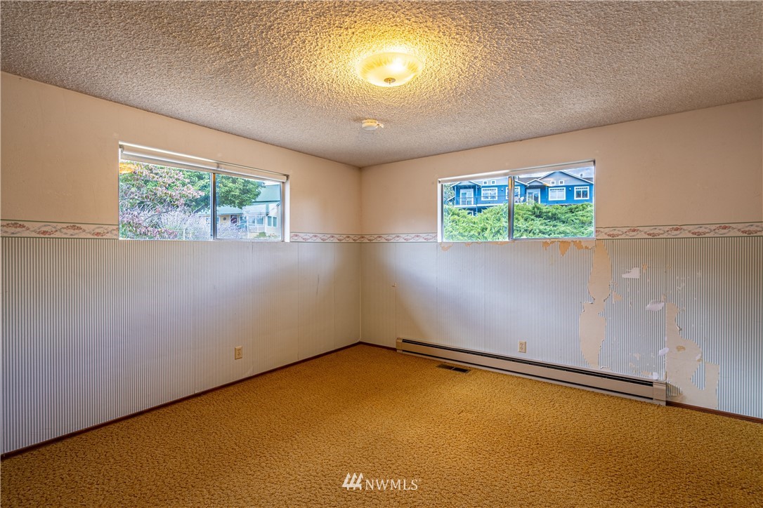 755 Wapato Way Manson, WA 98831 - Photo 18 of 40 an empty room with windows