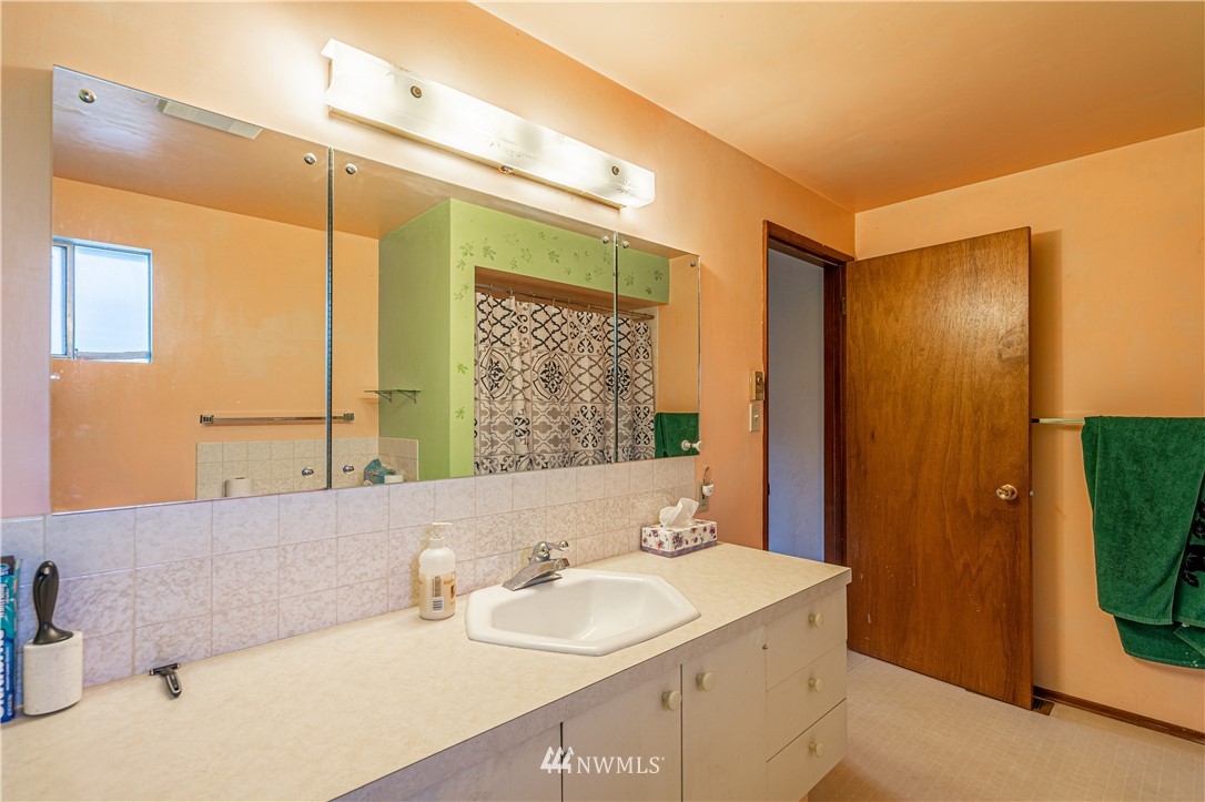 755 Wapato Way Manson, WA 98831 - Photo 21 of 40 a bathroom with a sink and a mirror