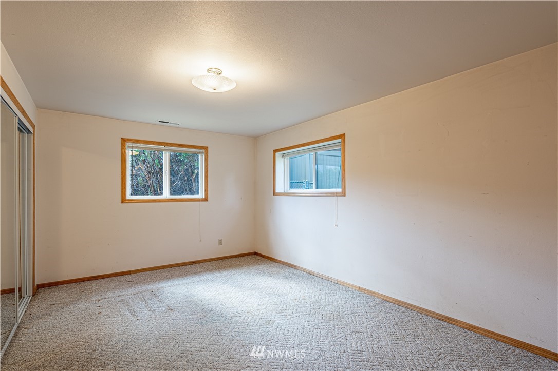 755 Wapato Way Manson, WA 98831 - Photo 25 of 40 an empty room with a window