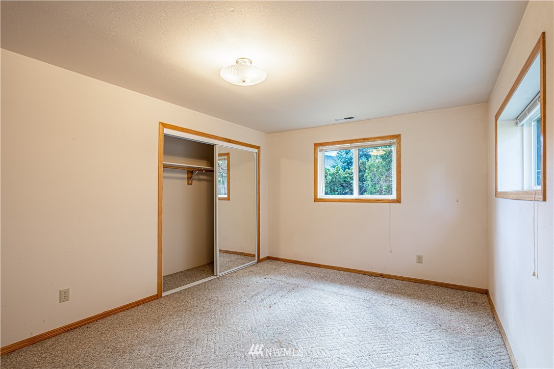 755 Wapato Way Manson, WA 98831 - Photo 26 of 40 an empty room with windows