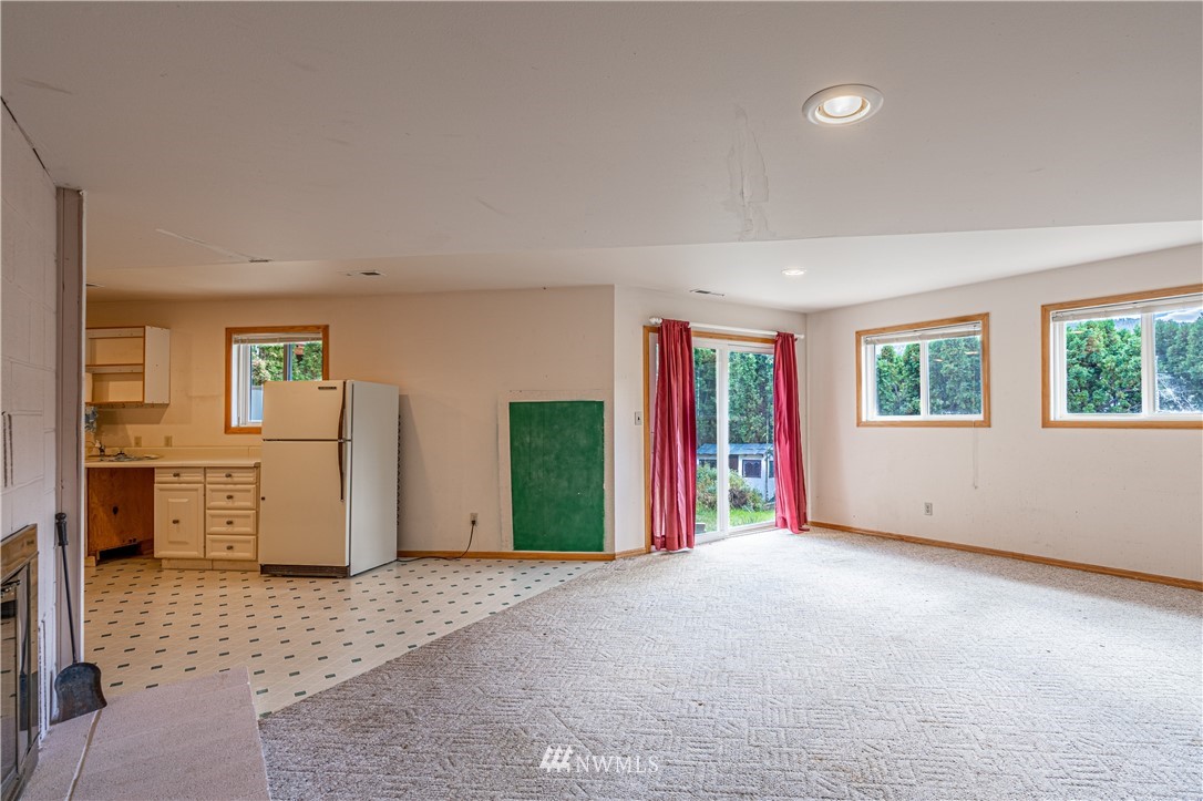 755 Wapato Way Manson, WA 98831 - Photo 29 of 40 a view of an empty room with window and cabinet
