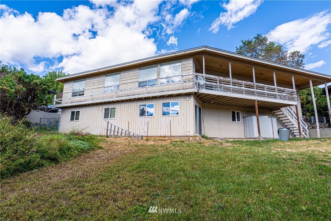755 Wapato Way Manson, WA 98831 - Photo 38 of 40 a front view of a house with a yard