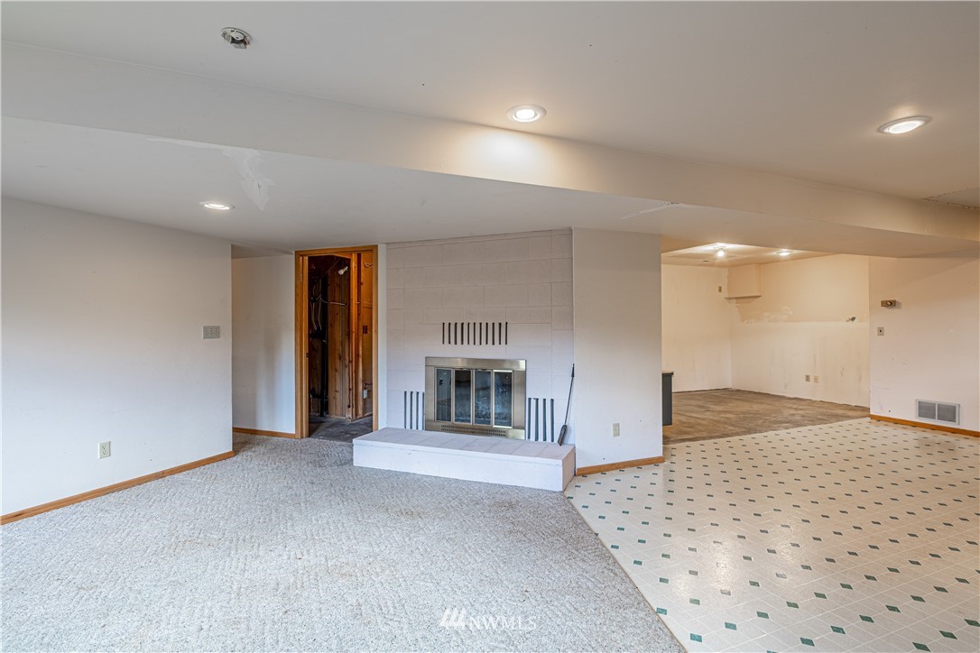 755 Wapato Way Manson, WA 98831 - Photo 39 of 40 a view of an empty room with a fireplace