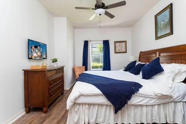 a bedroom with a bed and a dresser