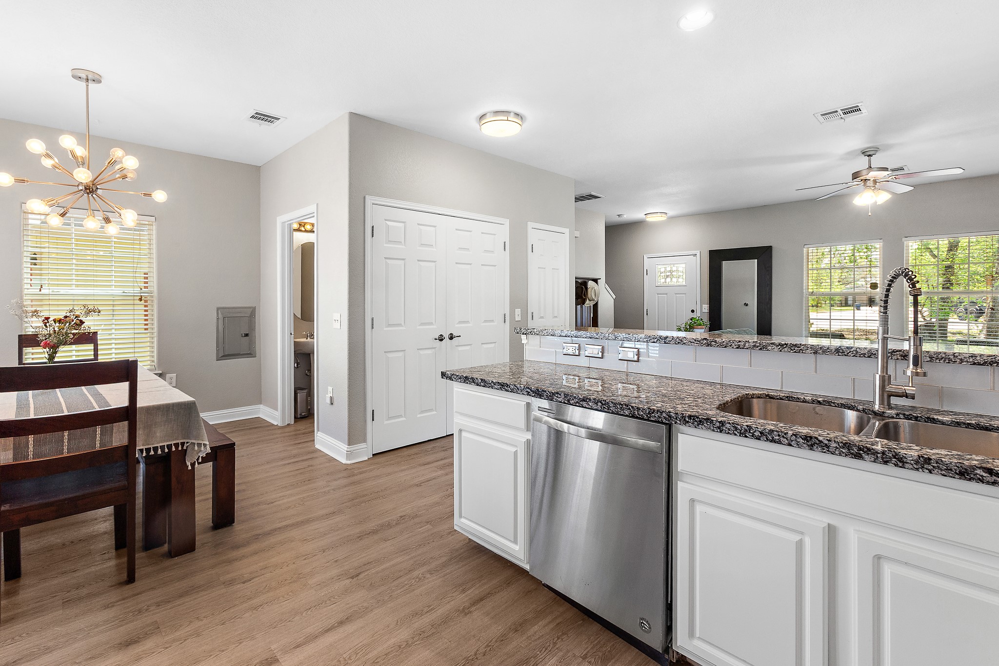 914 Bret Lane Austin, TX 78721 - Photo 11 of 33 a large kitchen with kitchen island a sink and a wooden floors