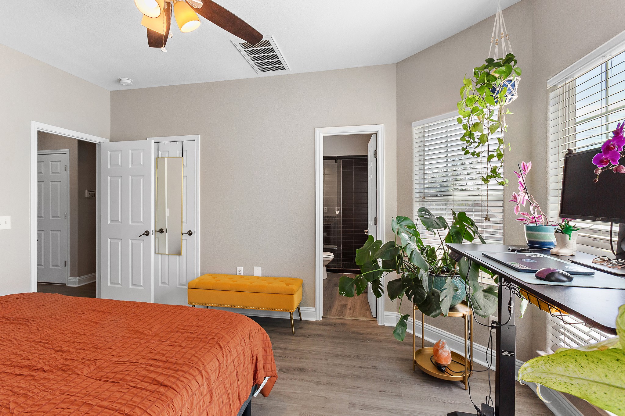 914 Bret Lane Austin, TX 78721 - Photo 15 of 33 a bedroom with a bed and a potted plant