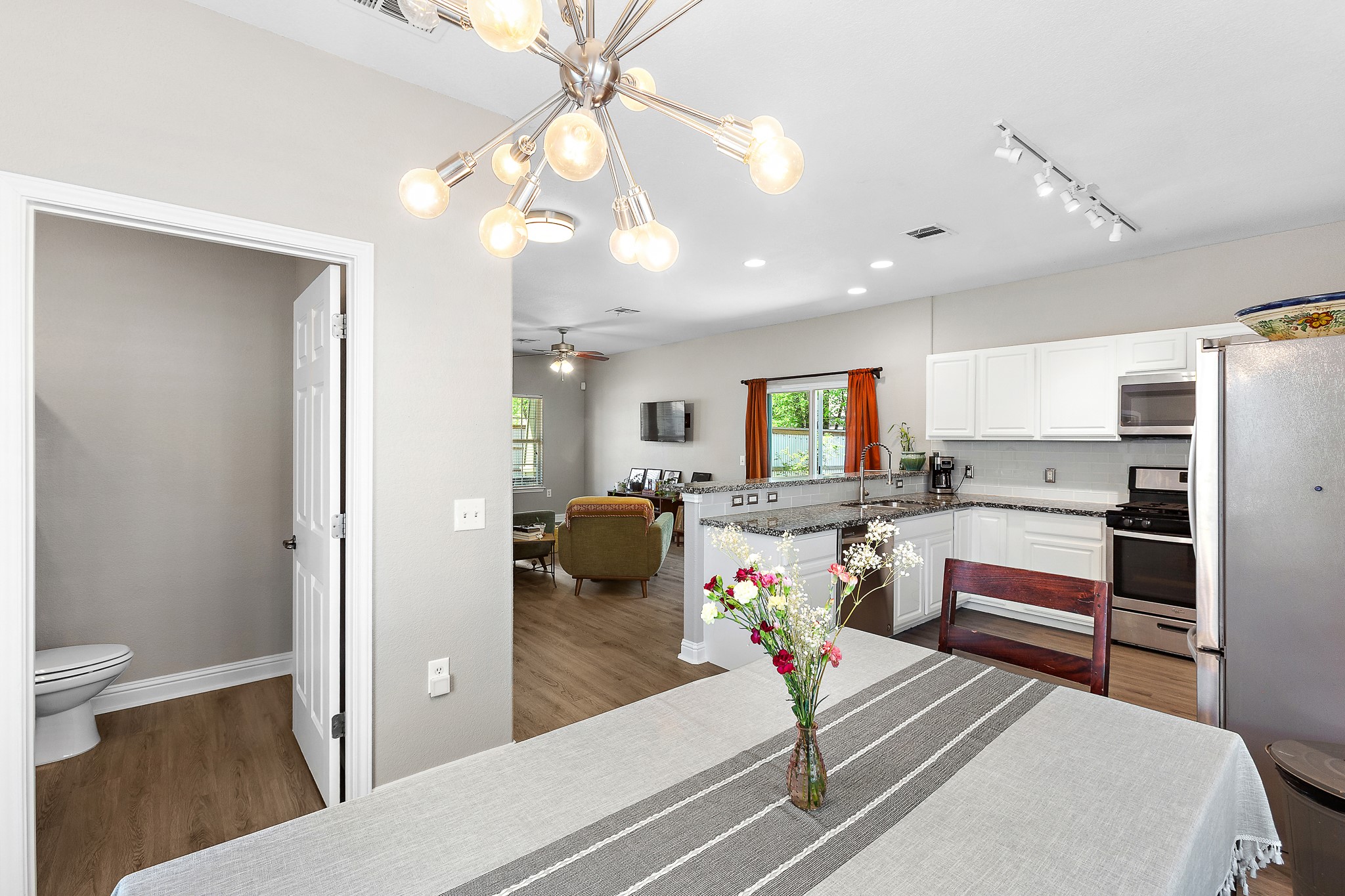914 Bret Lane Austin, TX 78721 - Photo 17 of 34 a living room with furniture and a flat screen tv