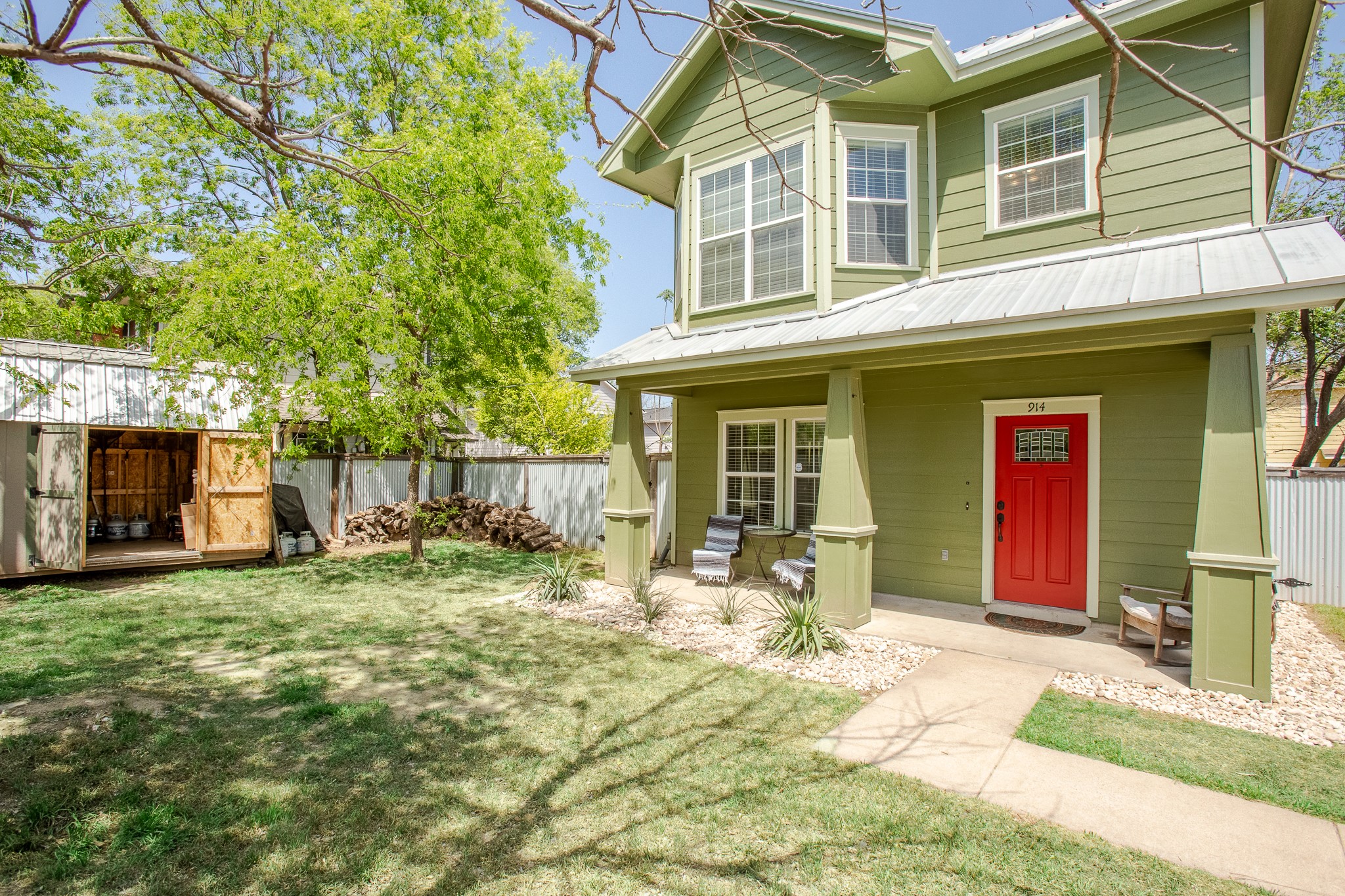 914 Bret Lane Austin, TX 78721 - Photo 2 of 34 a front view of a house with a yard outdoor seating and garage