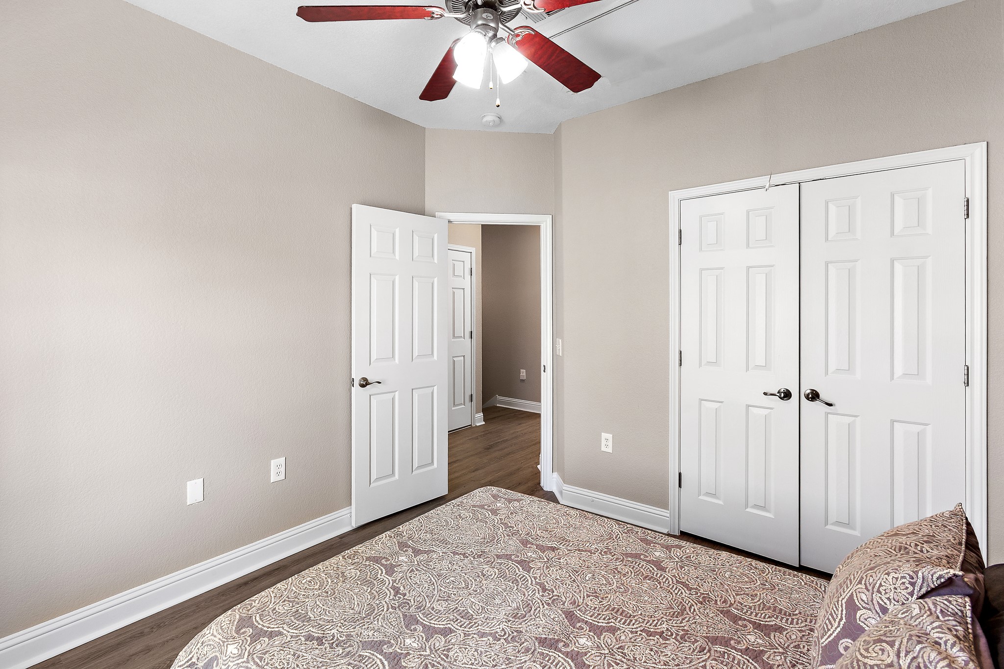 914 Bret Lane Austin, TX 78721 - Photo 21 of 33 wooden floor in an empty room with a ceiling fan