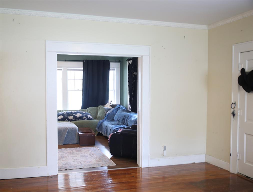 1500 Bonham Street Commerce, TX 75428 - Photo 15 of 29 a living room with furniture and a window