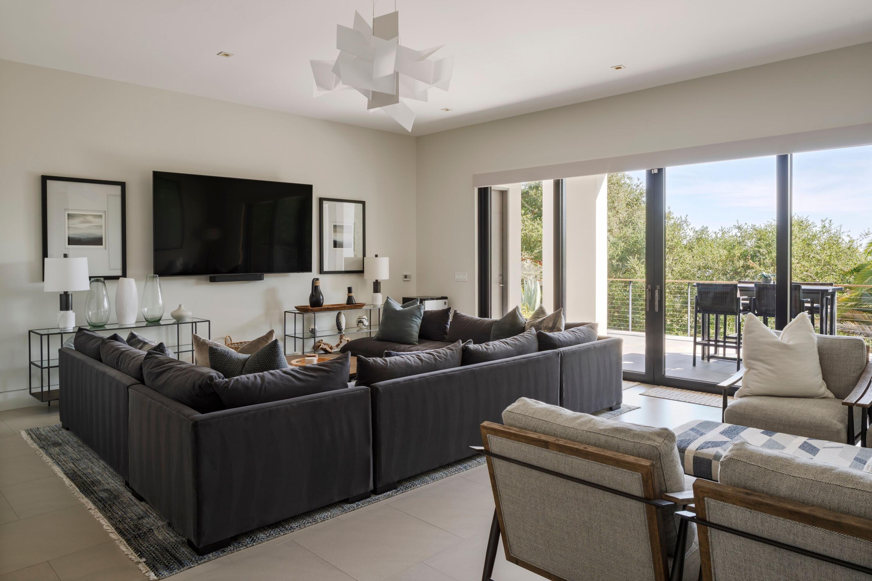 1131 Las Alturas Road, Unit A Santa Barbara, CA 93103 - Photo 15 of 47 a living room with furniture and a flat screen tv