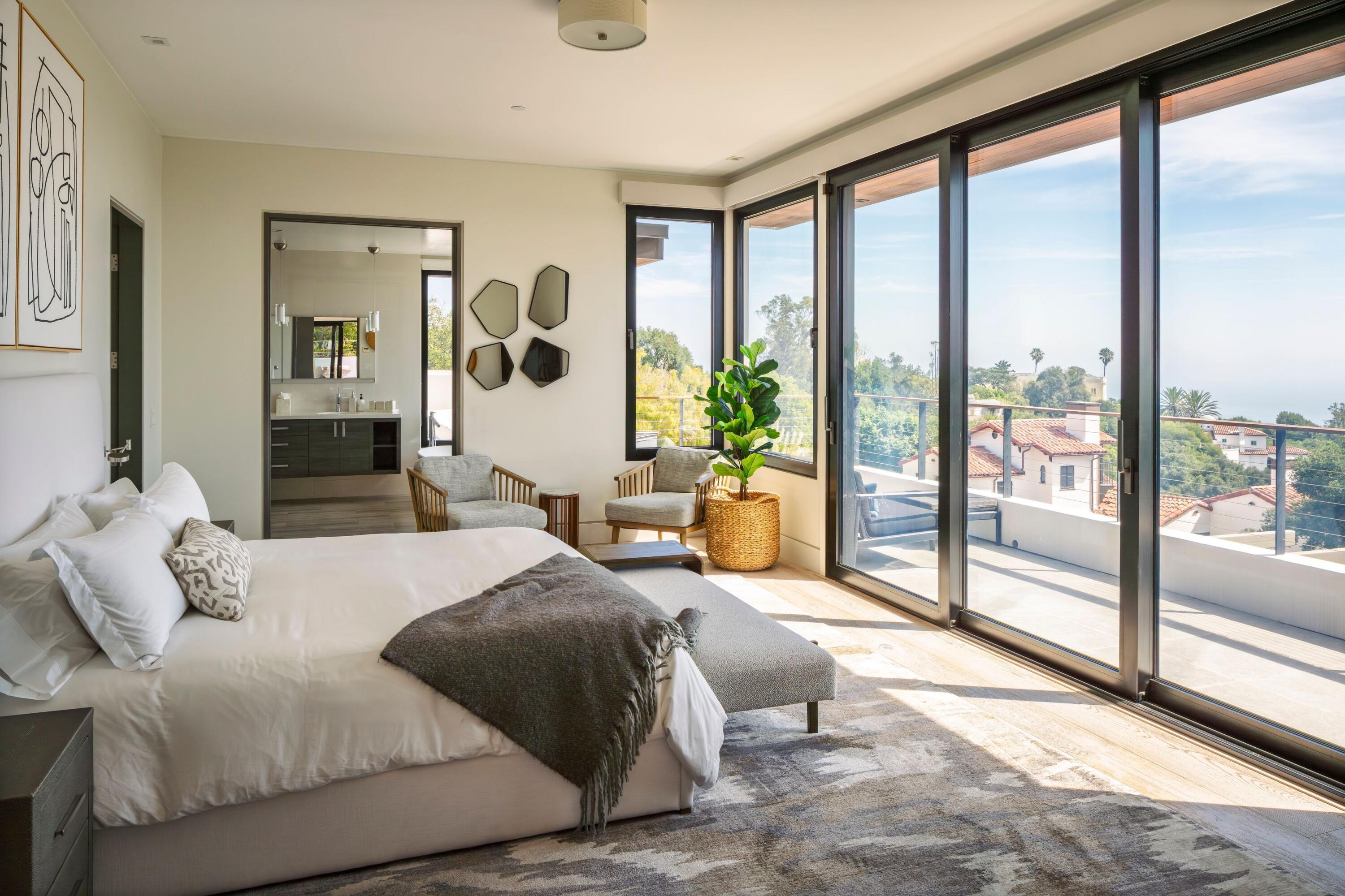 1131 Las Alturas Road, Unit A Santa Barbara, CA 93103 - Photo 17 of 47 a bedroom with a large bed and a large window
