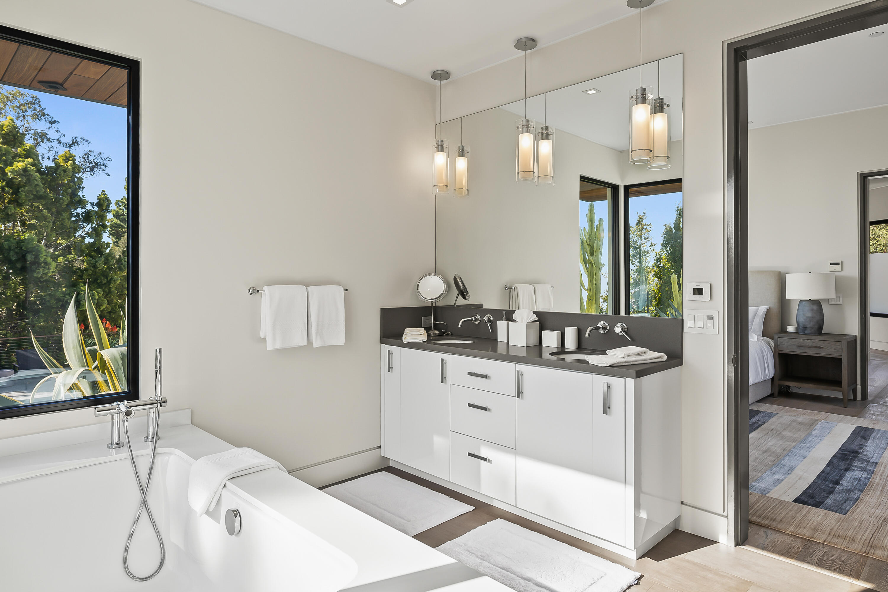 1131 Las Alturas Road, Unit SHARE A Santa Barbara, CA 93103 - Photo 23 of 32 a spacious bathroom with a double vanity sink and a mirror