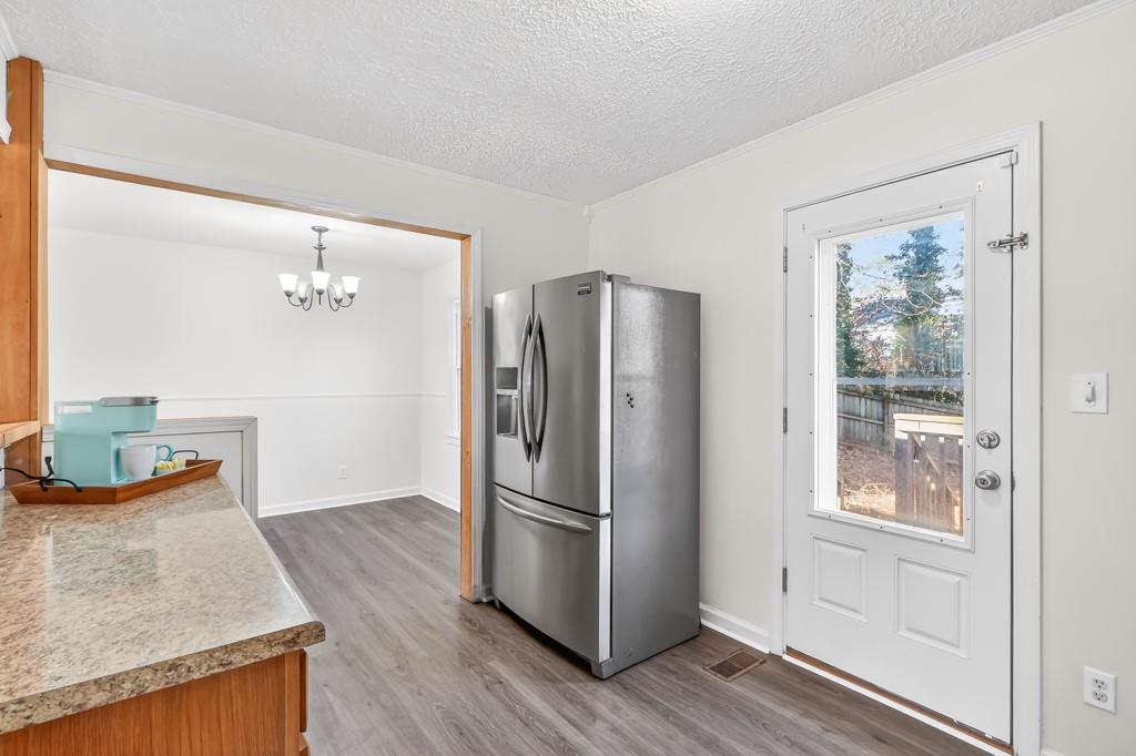 4703 North Springs Road Northwest Kennesaw, GA 30144 - Photo 12 of 35 a kitchen with stainless steel appliances granite countertop a refrigerator and a stove
