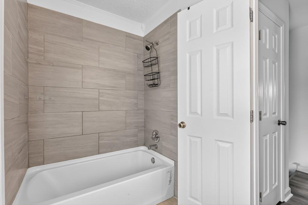 4703 North Springs Road Northwest Kennesaw, GA 30144 - Photo 20 of 35 a bathroom with a bathtub