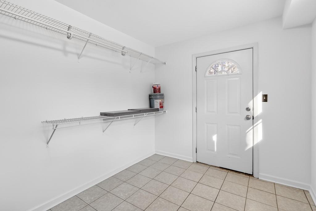4703 North Springs Road Northwest Kennesaw, GA 30144 - Photo 27 of 35 a view of storage and utility room with racks on the wall